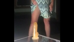 Riding her suction cup dildo