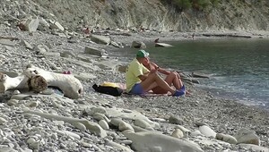 Beach nudist couples handjob