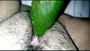 Bbw plays with a cucumber