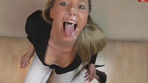 Blonde girl gets cumshot while chained and played with dildo
