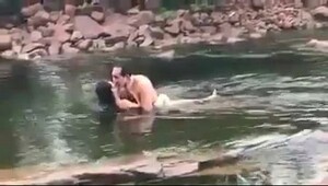River bath nude, woman enjoys a delightful session