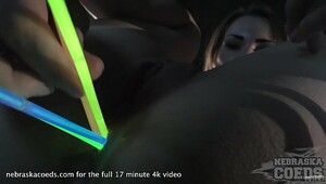 Chick fucks herself in the dark with a glowstick