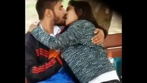 Indian girl boy kisses at park