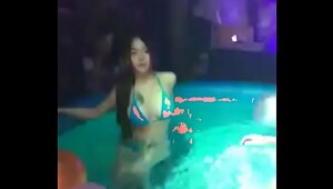 Fully clothed swimming in pool